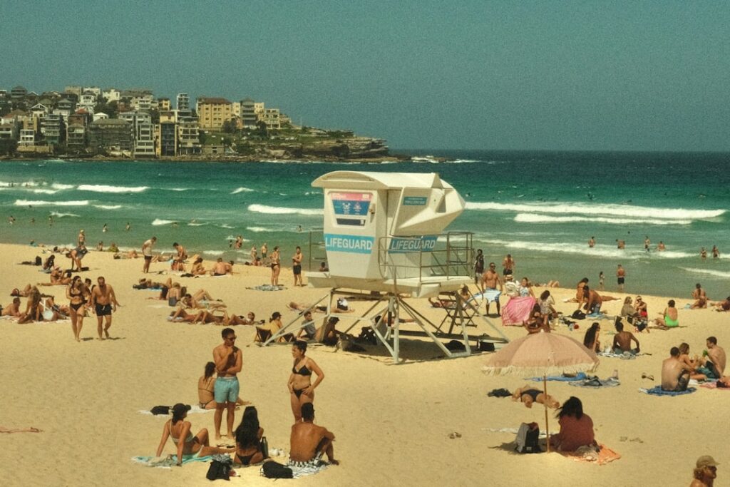 a crowded beach with many people on it